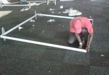 Setting up the frame for a portable fabric wall